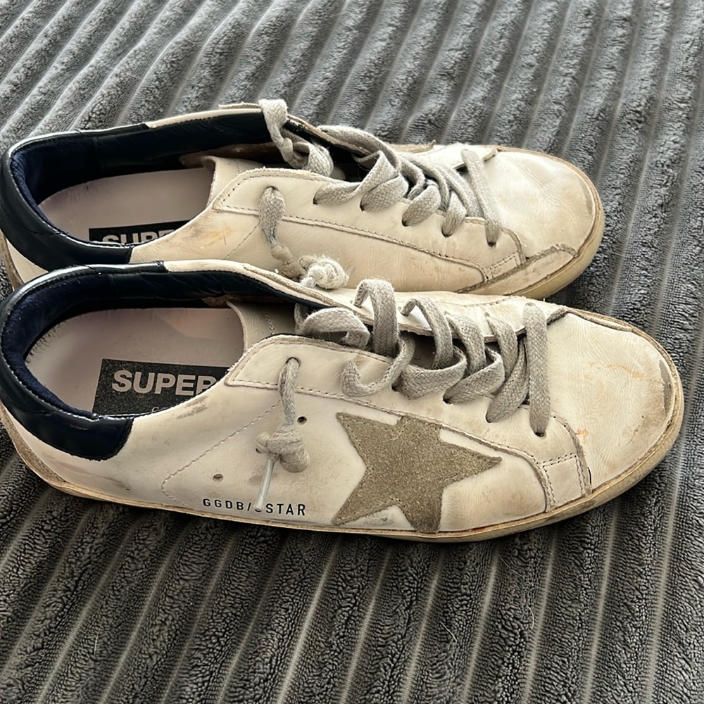 Golden Goose sneakers with grey detailing and navy blue back finish